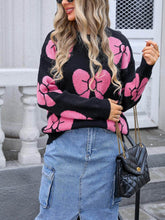 Suéter holgado de punto con cuello redondo y lazo